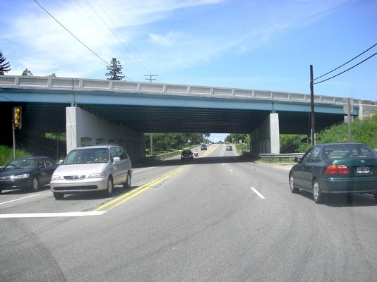 You will now be headed west (away from downtown) and cross under I-94.